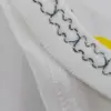 Pyjama en coton doux, style décontracté avec motifs citron, pour une tenue d'intérieur confortable et lumineuse.