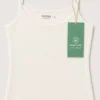 Débardeur en coton biologique, couleur crème, parfait pour une tenue d'intérieur confortable et élégante.
